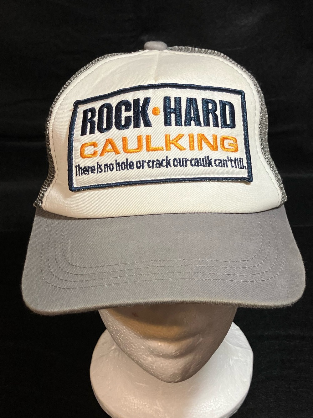 Spirit Halloween Rock Hard Caulking Funny Trucker Hat Gray Mesh Snapback Cap